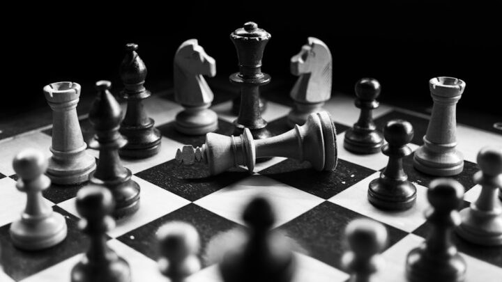 Chess pieces on a board illustrating AI chess coaching and strategy