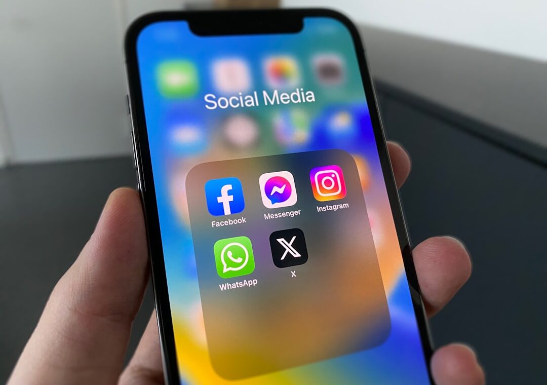 Smartphone displaying social media apps for Meta One subscription coverage