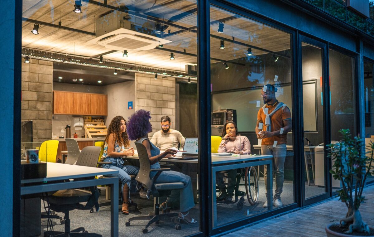 Microsoft employees collaborating as part of the company's AI transformation