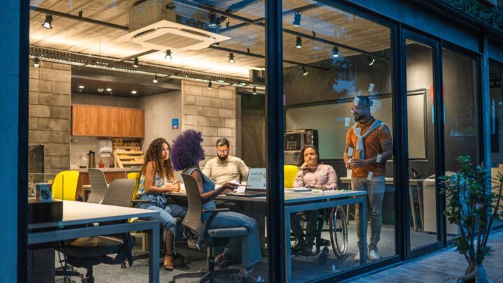 Microsoft employees collaborating as part of the company's AI transformation