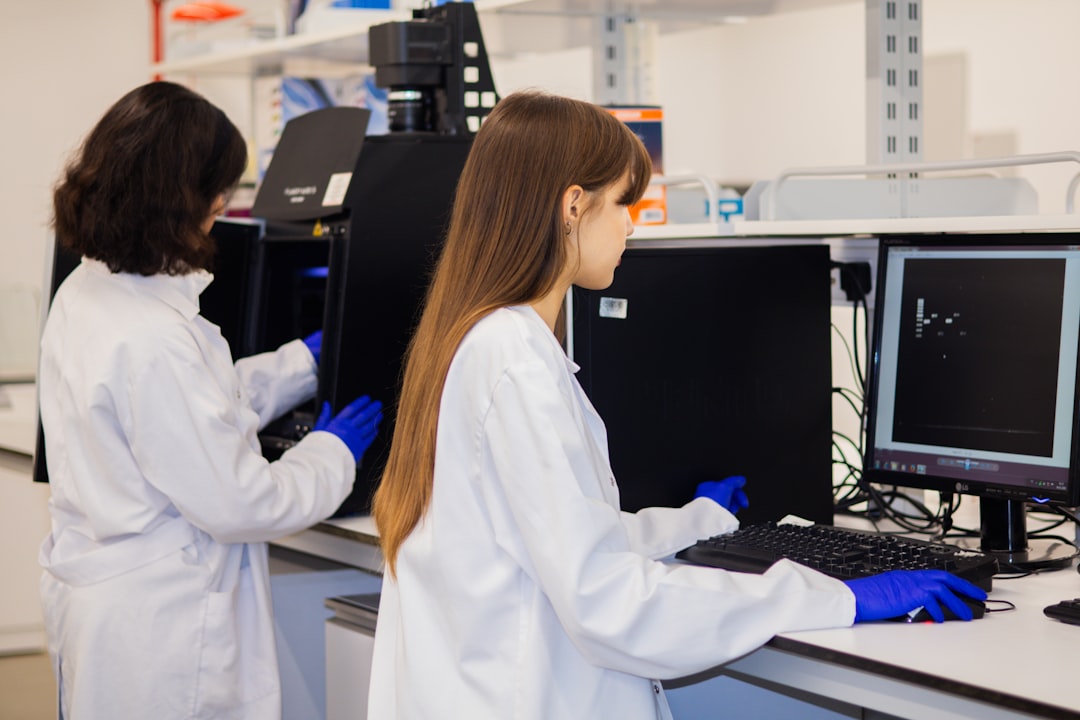 Researchers working with computers illustrating AI-assisted research