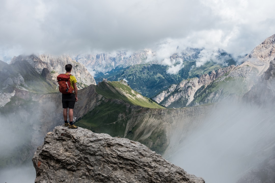 Hiker overlooking mountains, illustrative image for Apple Watch Ultra outdoor adventure coverage