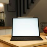 Tablet and digital equipment in a modern home kitchen, illustrative photo