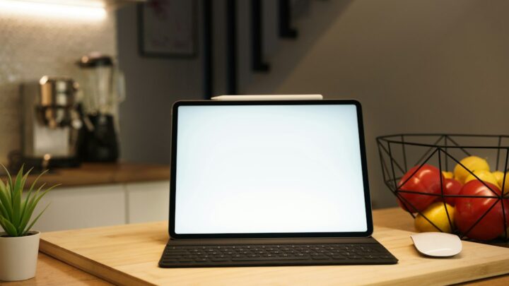 Tablet and digital equipment in a modern home kitchen, illustrative photo