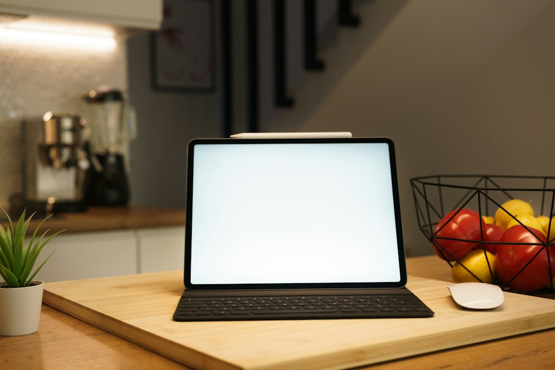 Tablet and digital equipment in a modern home kitchen, illustrative photo
