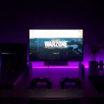 Gaming desk and monitor illustrating ways to play PlayStation games on a PC; photograph by Fábio Magalhães via Unsplash