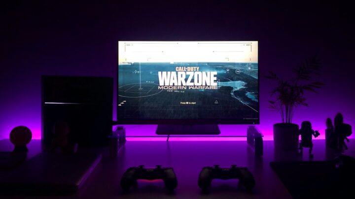 Gaming desk and monitor illustrating ways to play PlayStation games on a PC; photograph by Fábio Magalhães via Unsplash