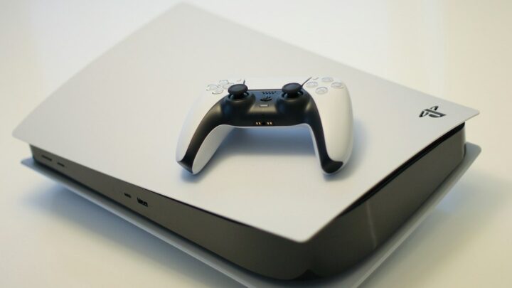 PlayStation 5 console and DualSense controller illustrating Sony QSSR AI upscaling